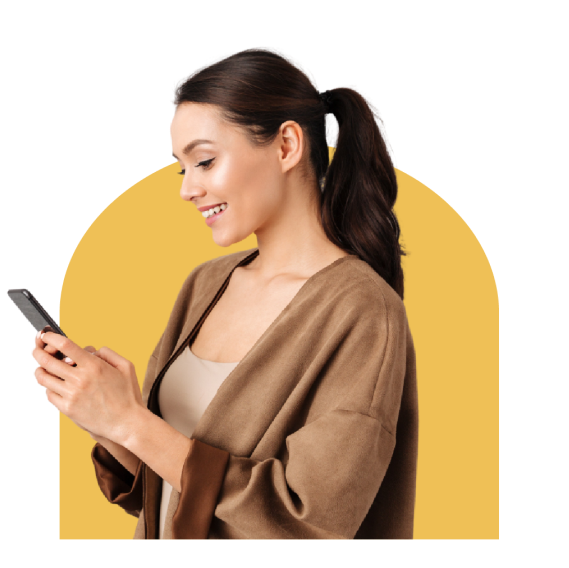 A woman looking at phone screen with a smile
