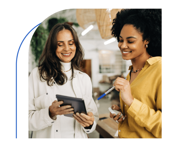 Picture of two women looking at tablet screen
