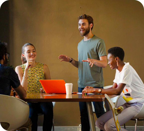 A group of people in a cheerful discussion at workplace